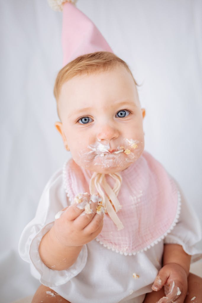 Birthday Baby with Sweet Food on Face